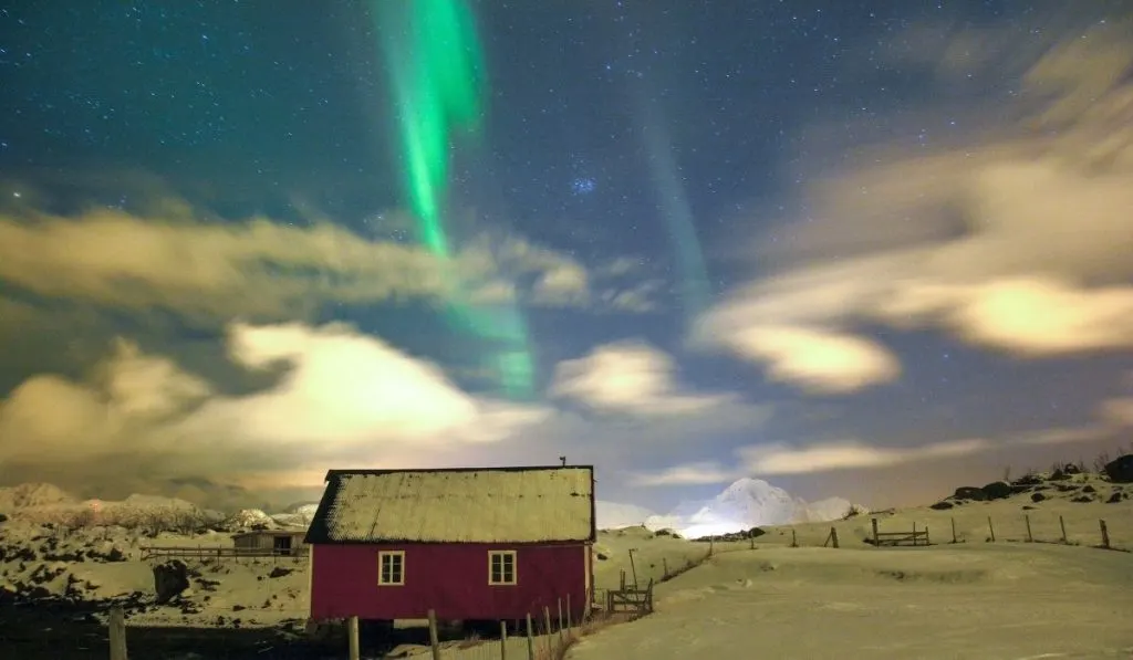 northern lights over a boat house in Lofoten Island - ee220327