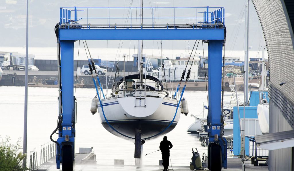 Sailboat in shipyard for maintenance in marina port